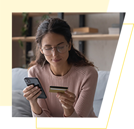 woman with phone and credit card