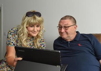 A Wolverhampton Homes team member talks to a customer