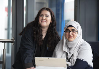 Two female Wolverhampton Homes team members smiling