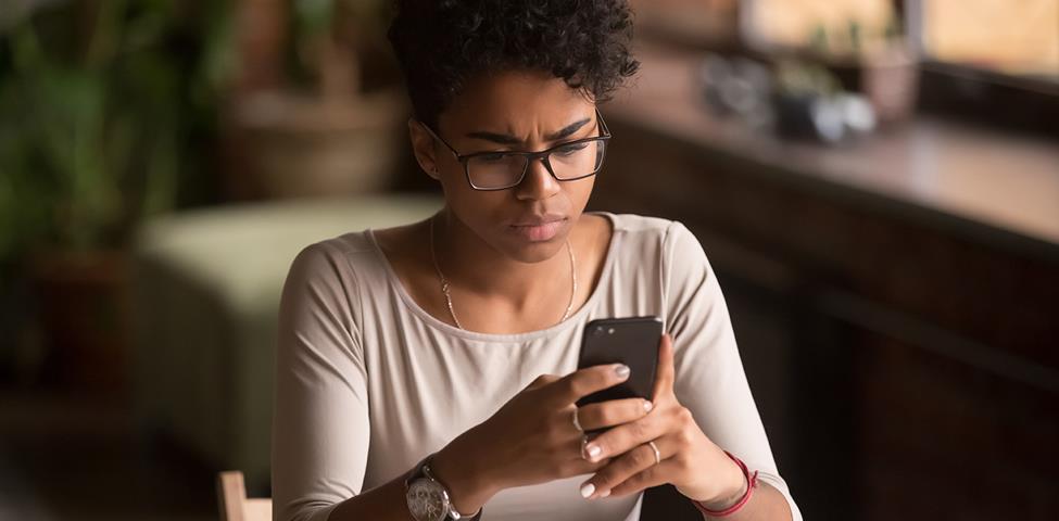 Person looking at mobile Person looking at mobile