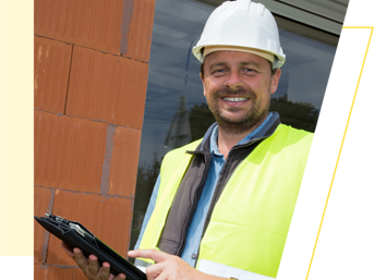 A trades operative wearing a hard hat and hi-vis vest