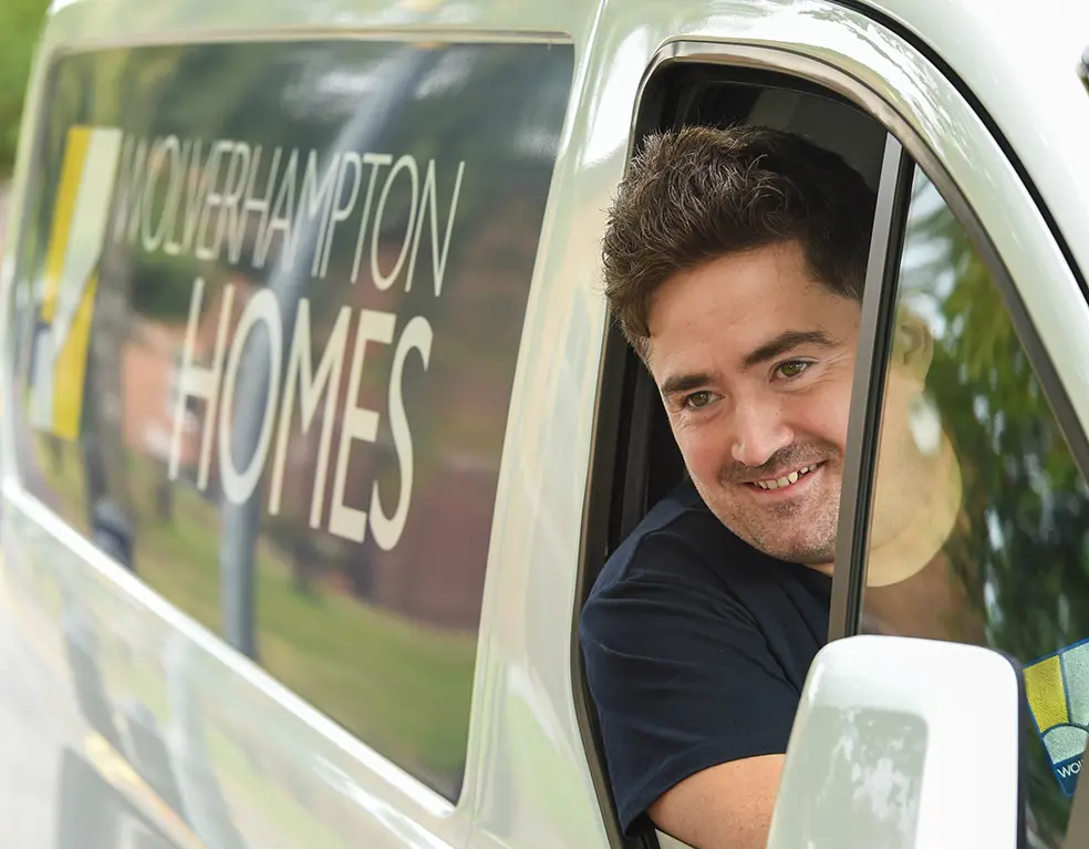 A Wolverhampton Homes operative looks out of a van