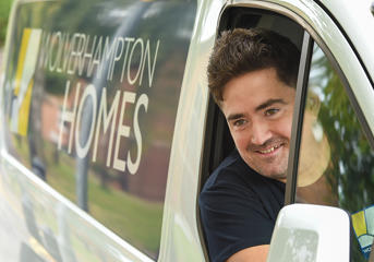 A Wolverhampton Homes operative looks out of a van