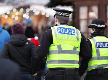 Police officers in high-visibility jackets at a public event