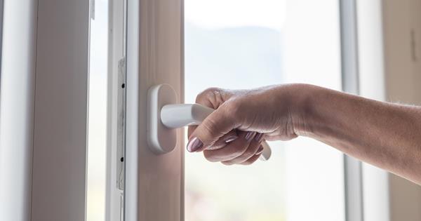Woman opening window