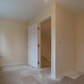 An empty first-floor room in a new-build home