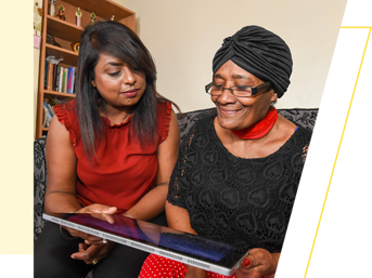 A customer and Wolverhampton Homes team member look at a laptop