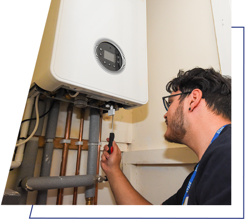 A Wolverhampton Homes operative checks a boiler