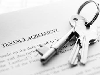 Photo of keys and a tenancy agreement