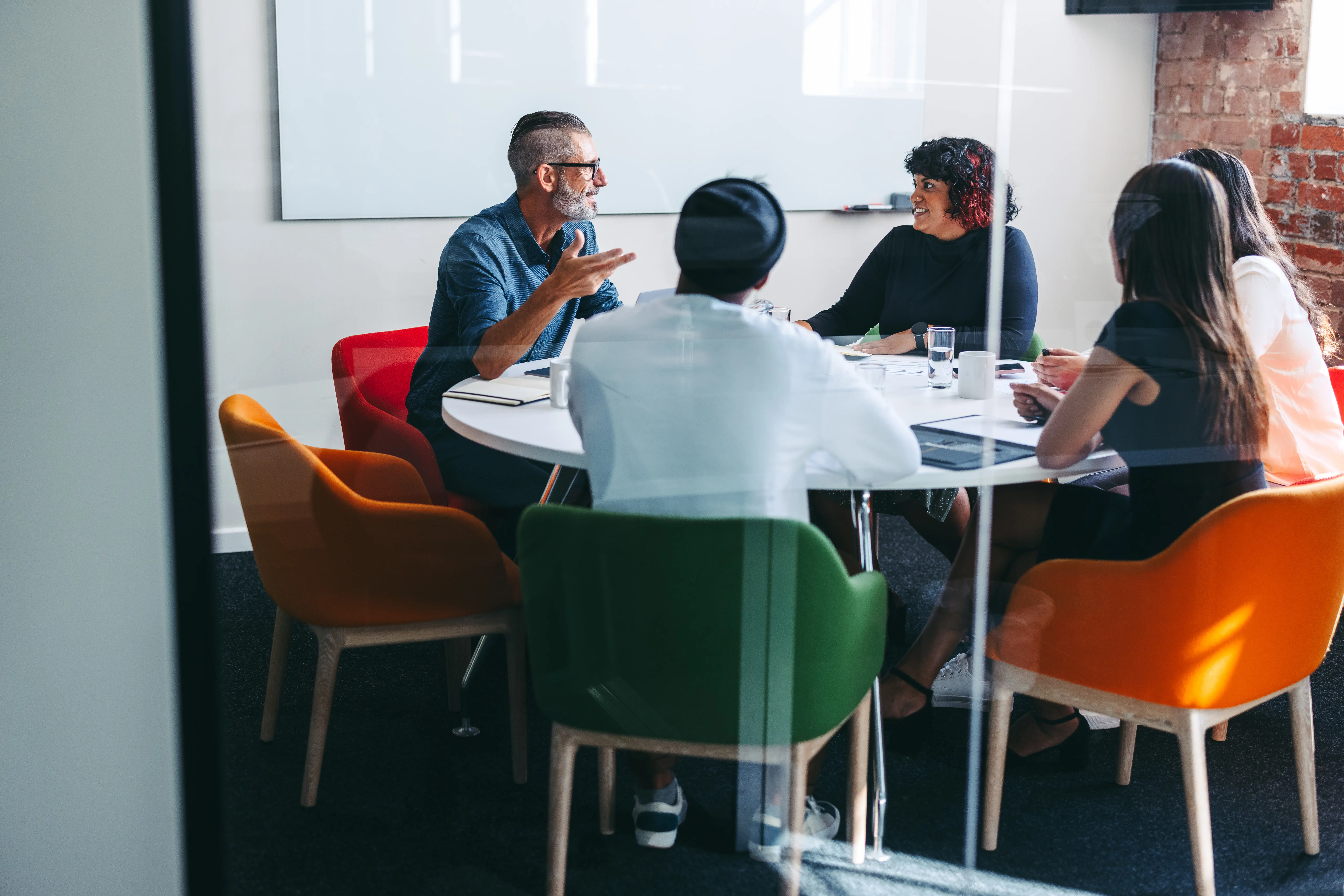 People sitting a t a meeting table