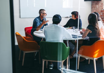 People sitting a t a meeting table