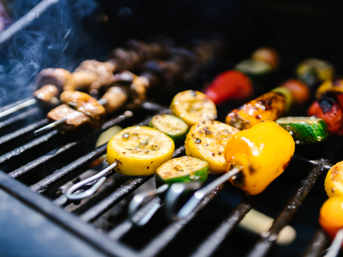 Skewers of vegetables on a barbecue
