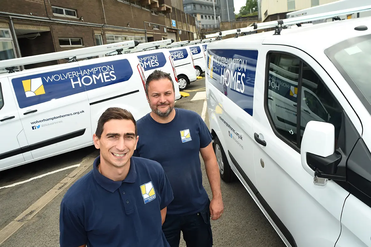 Wolverhampton Homes vans and two team members