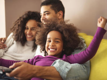 Family sitting on the sofa