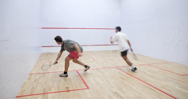Two people playing squash