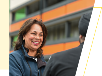 A Wolverhampton Homes team member smiles at a customer 