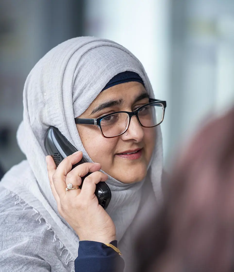 A Wolverhampton Homes team member speaks on the telephone