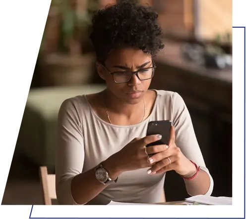 An image of a person looking at a mobile phone