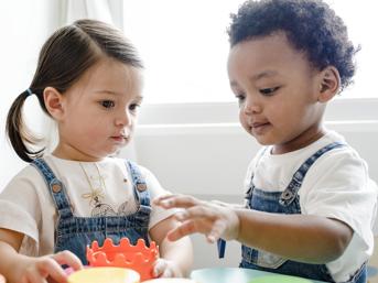Two toddlers, playing 