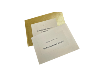 A gold envelope that says And the winner is Wolverhampton Homes