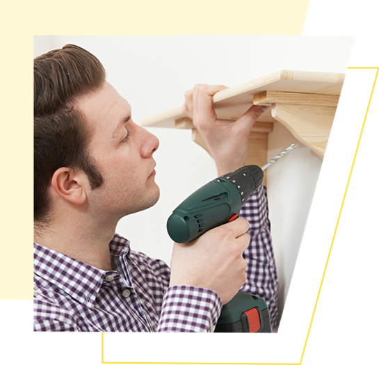 Man Putting Up Shelf