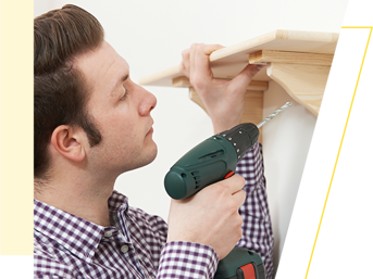Man Putting Up Shelf