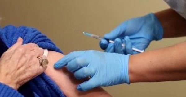 Woman receiving Covid-19 vaccine
