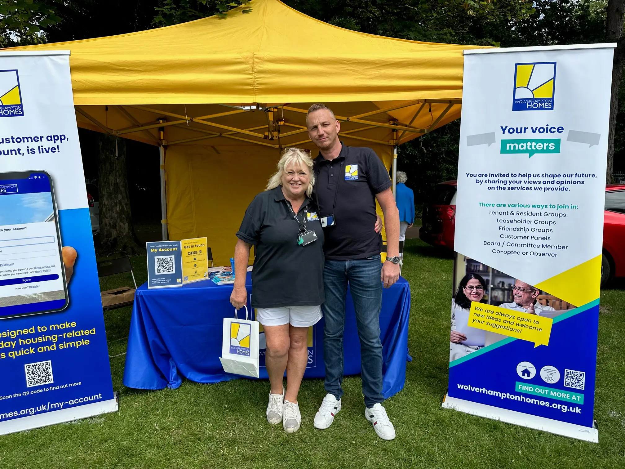 Two team members at a WH stall at Armed Forces Day