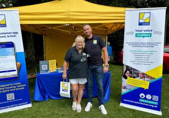 Two team members at a WH stall at Armed Forces Day