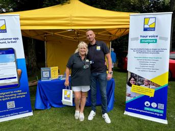 Two team members at a WH stall at Armed Forces Day