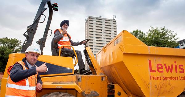 Cllr Gakhal sitting on digger at Heath Town