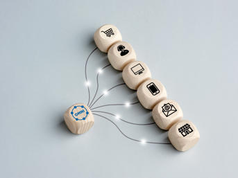 Six cubes with icons on all linking to one cube that has omni stamped on it