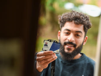 A Wolverhampton Homes operative shows his ID to a customer