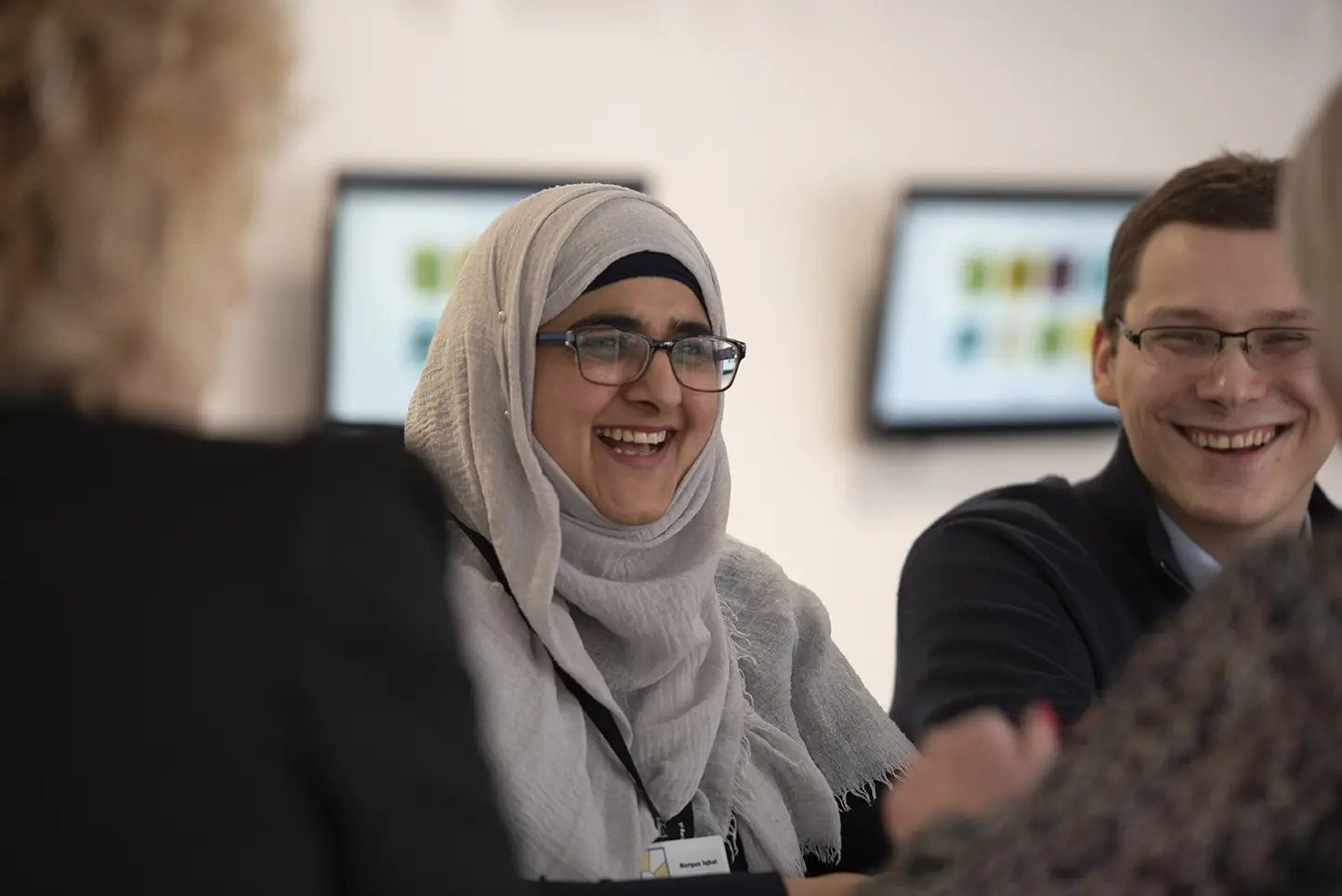 A female and male Wolverhampton Homes team member smiling